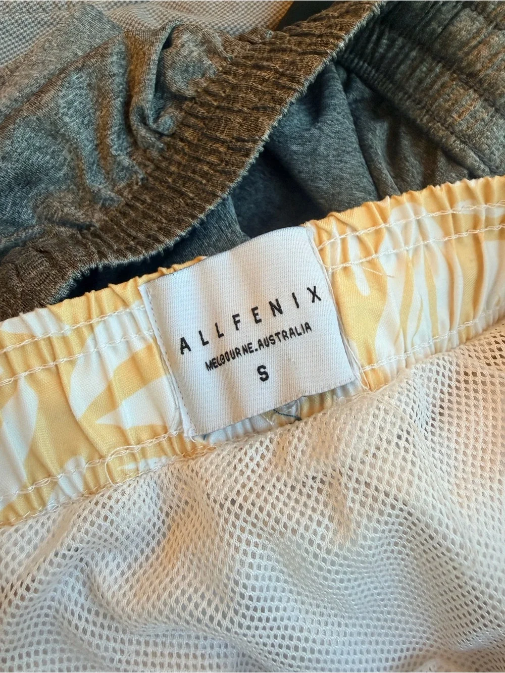 Allfenix men’s yellow Floral swim trunks